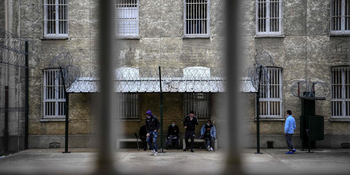 Detained patients gather in the courtyard of the Fresnes penitentiary